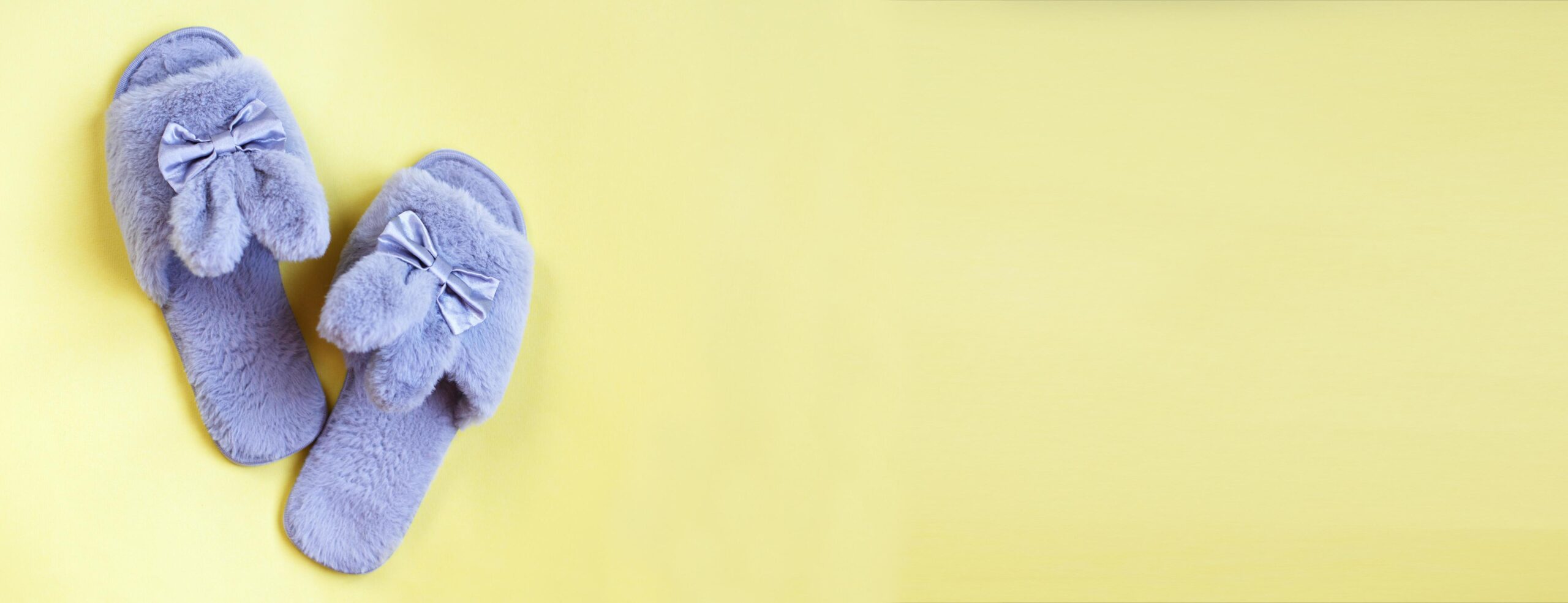 Front Page 1 Front Page -Sperry Shop pair of stylish soft slippers on yellow background flat lay copy space for text banner free photo scaled